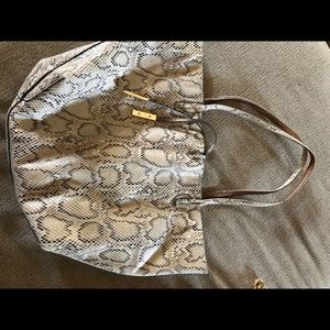 Reversible snakeskin/gold bag